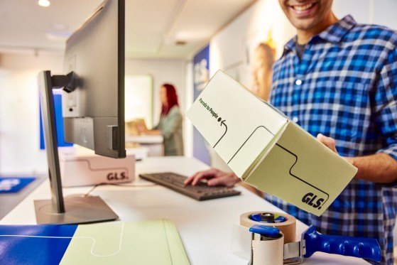 A woman with a parcel in a parcelShop