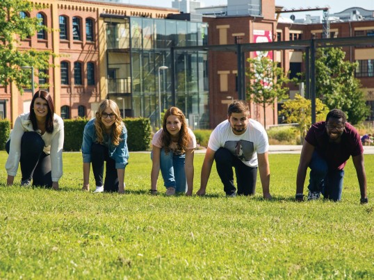 GLS trainees ready to gon on a university lawn