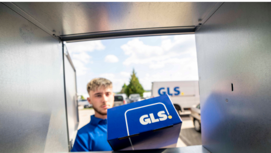 Male delivery driver dropping off packages from a GLS US van